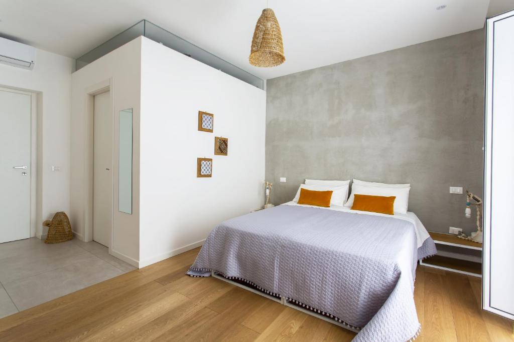Postel nebo postele na pokoji v ubytování Canceddi Rooms