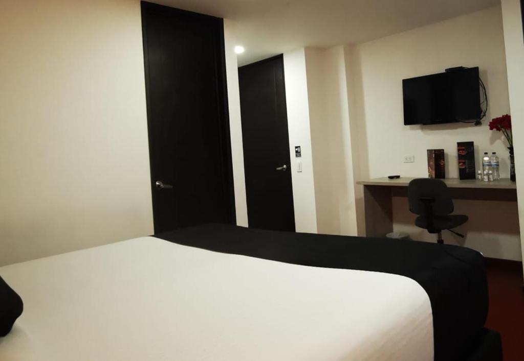 Postel nebo postele na pokoji v ubytování Hotel Radel Superior