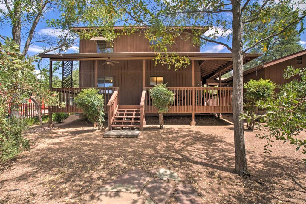a home with a large deck and a house at Pet-Friendly Payson Cabin with Deck Close to Hikes! in Payson