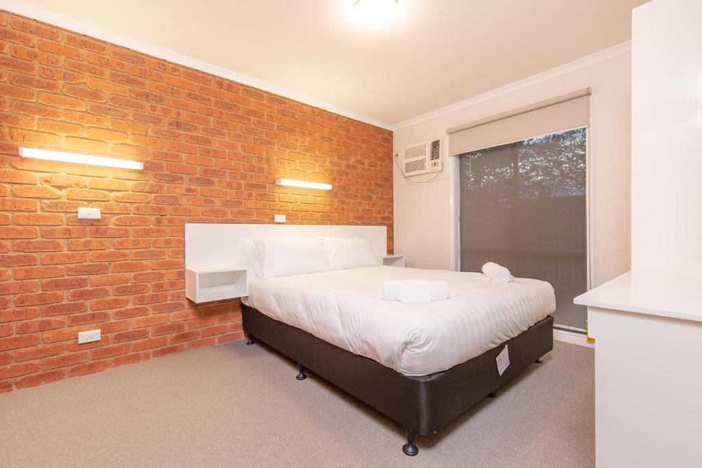 Postel nebo postele na pokoji v ubytování Mildura City Gate Motel