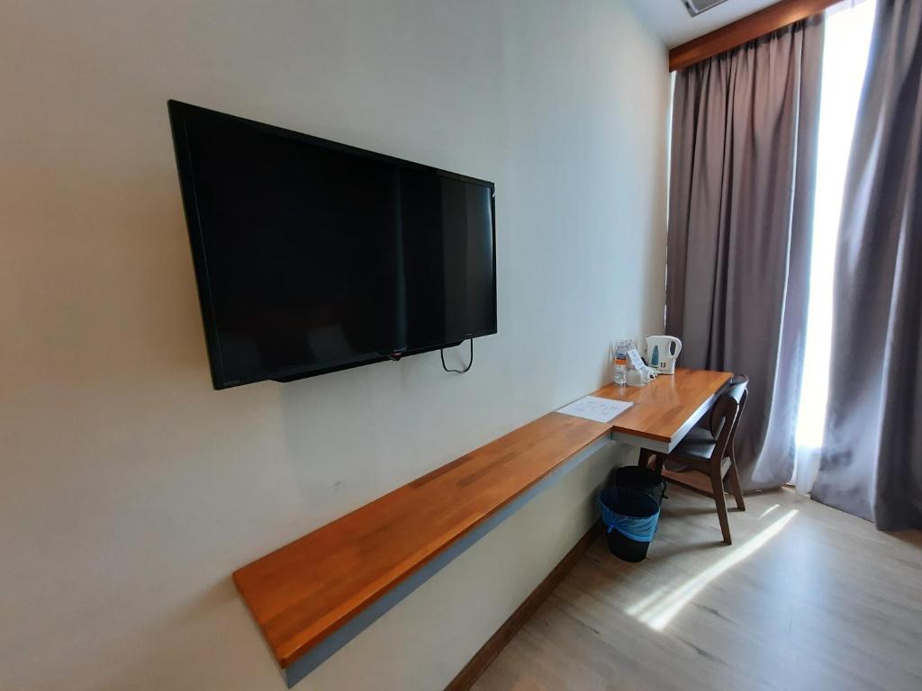 TV a/nebo společenská místnost v ubytování Hotin Inn