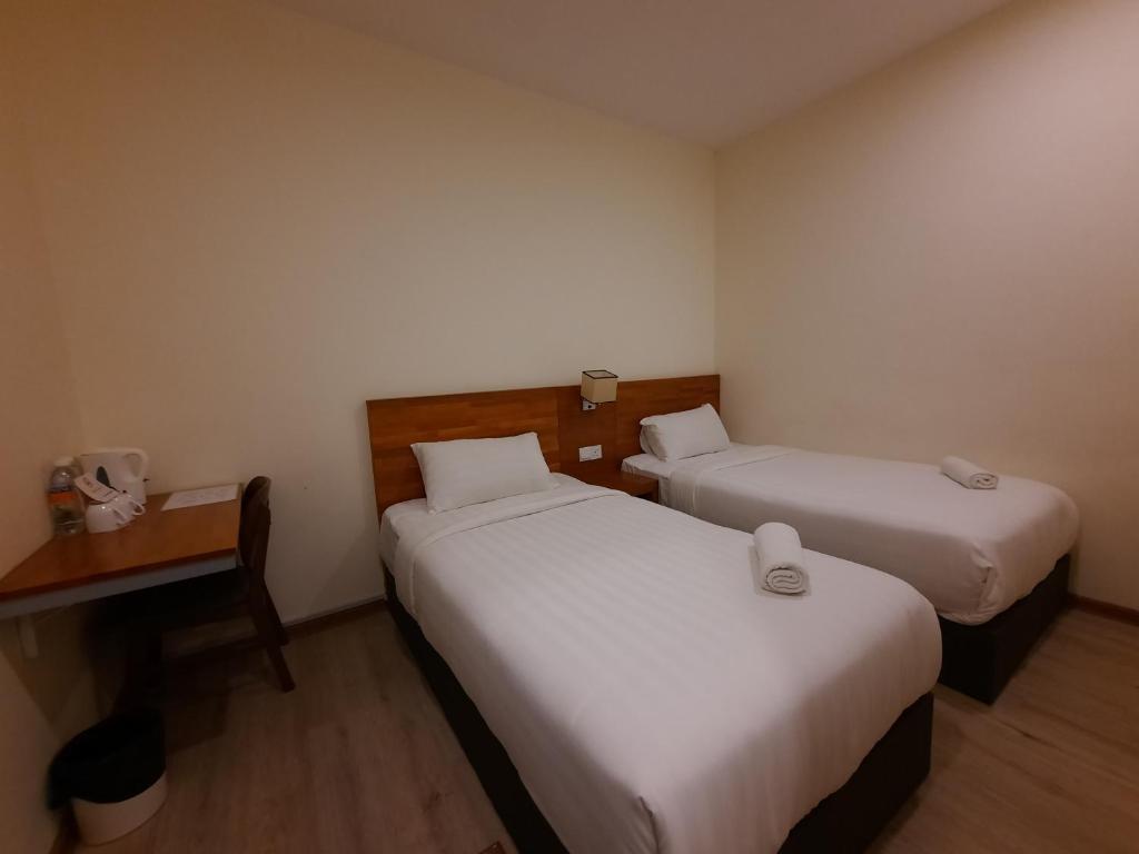 Postel nebo postele na pokoji v ubytování Hotin Inn