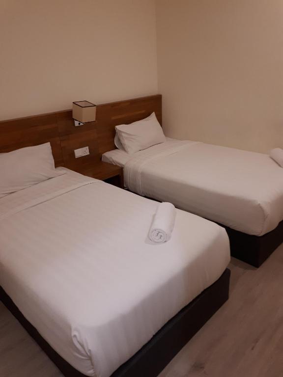 Postel nebo postele na pokoji v ubytování Hotin Inn