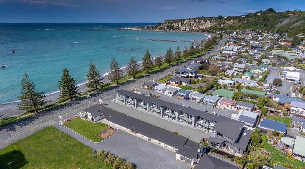 an aerial view of a town next to the ocean at Kaikoura Waterfront Apartments in Kaikoura