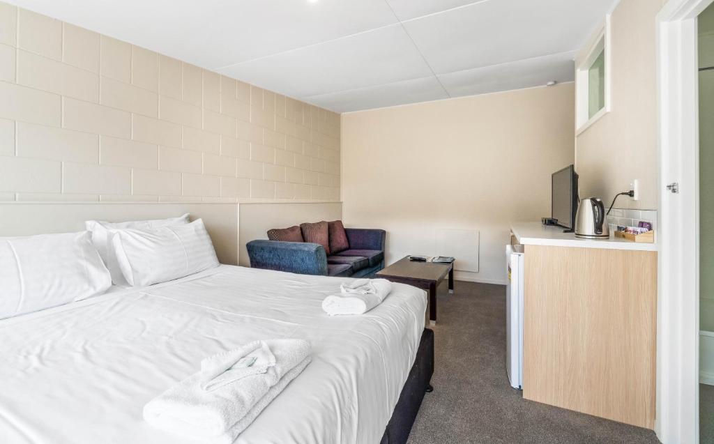 Postel nebo postele na pokoji v ubytování Kaikoura Beach Motel