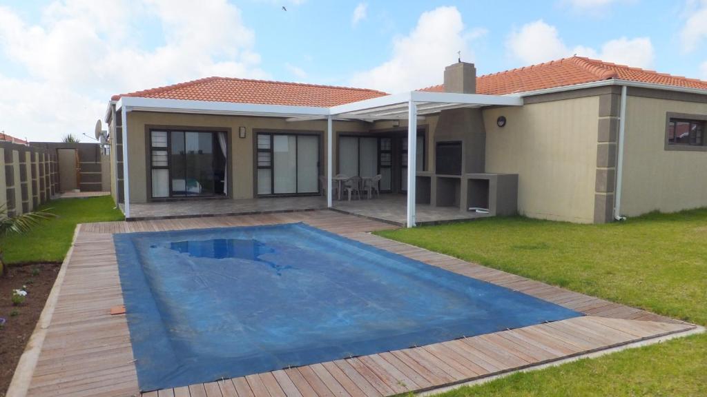 a house with a swimming pool in the yard at B.R.O.Homes and Villas in Port Elizabeth