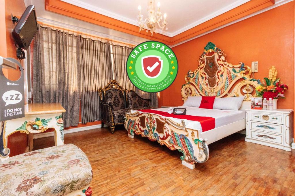 Postel nebo postele na pokoji v ubytování RedDoorz Manila Venetian Hotel