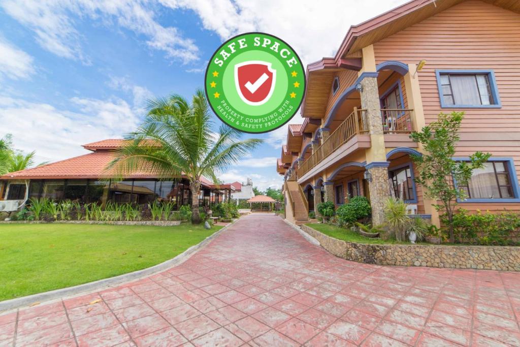 a house with a sign in front of it at RedDoorz Plus @ Starhomes Olivianville in Tarlac