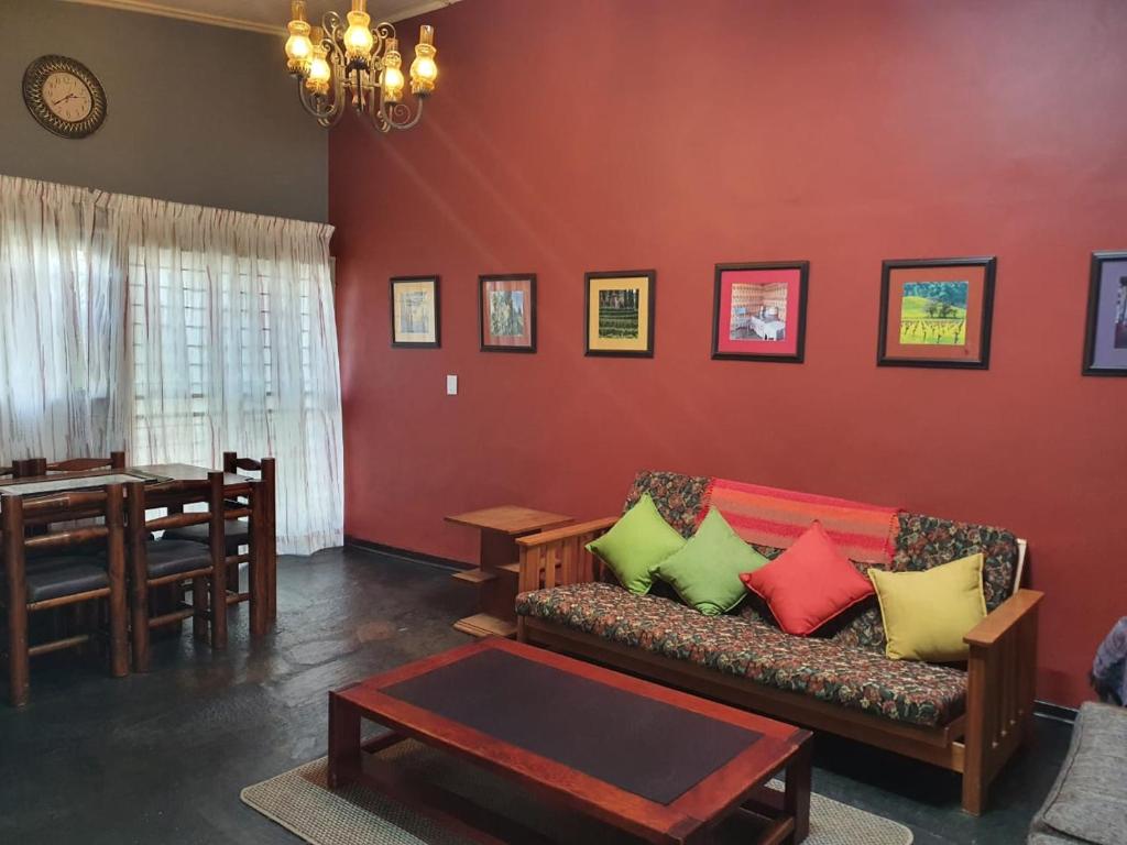 a living room with a couch and a table at Karee Laagte in Leeuwfontein