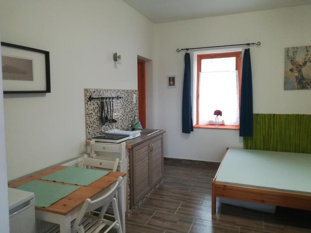 Postel nebo postele na pokoji v ubytování Négy Tücsök Vendégház