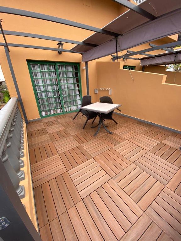 an office with a table and chairs on a wooden floor at Hotel Ida Inés in Frontera