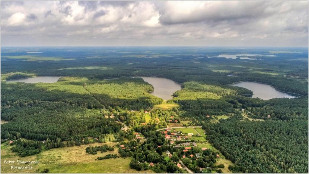 an aerial view of a town and two reservoirs at Apartament w Villa Konik Mazury in Rekownica