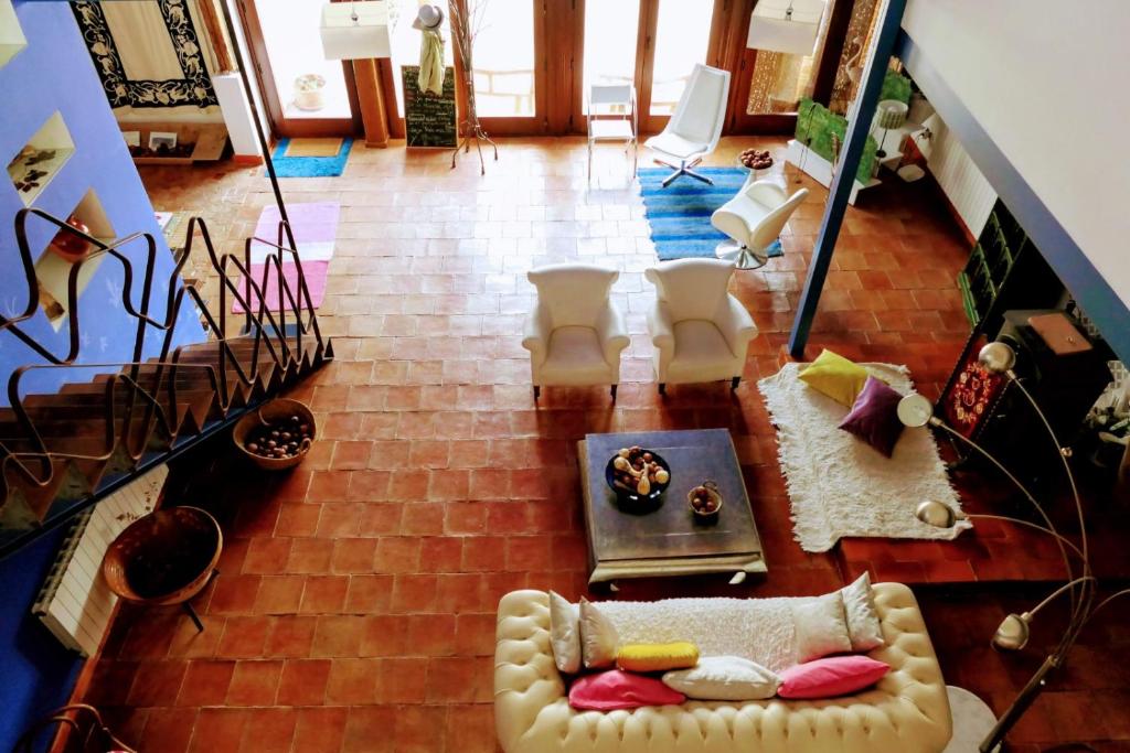 a living room with a couch and a table at Casa Rural Santa Ana in Miguel Esteban
