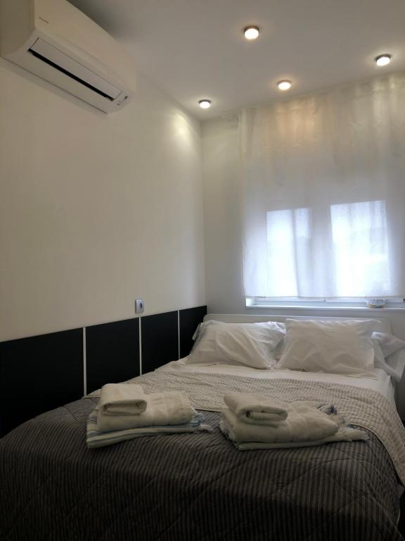 Posteľ alebo postele v izbe v ubytovaní ASV Apartments