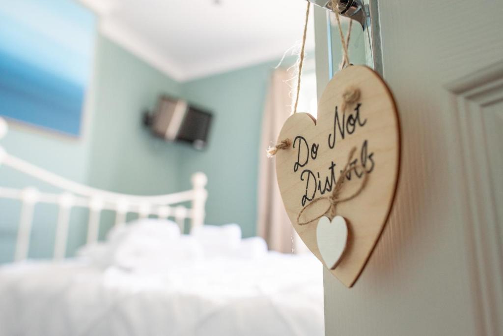 Кровать или кровати в номере Clovelly Guest House