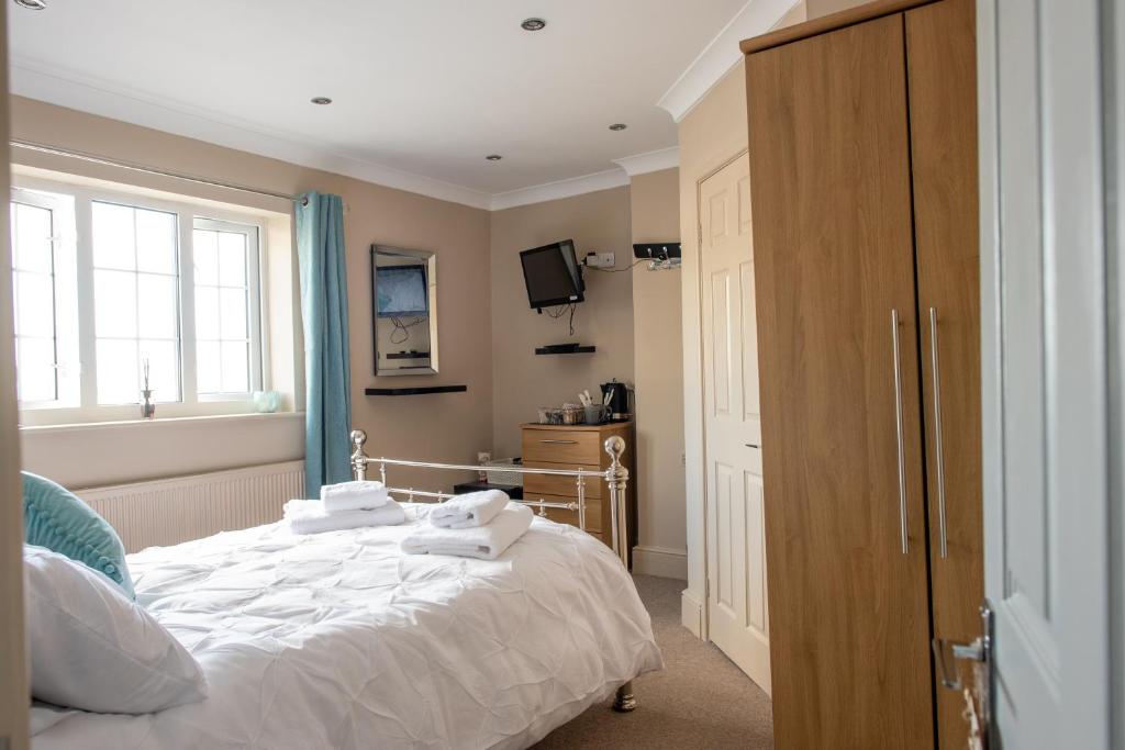 Кровать или кровати в номере Clovelly Guest House