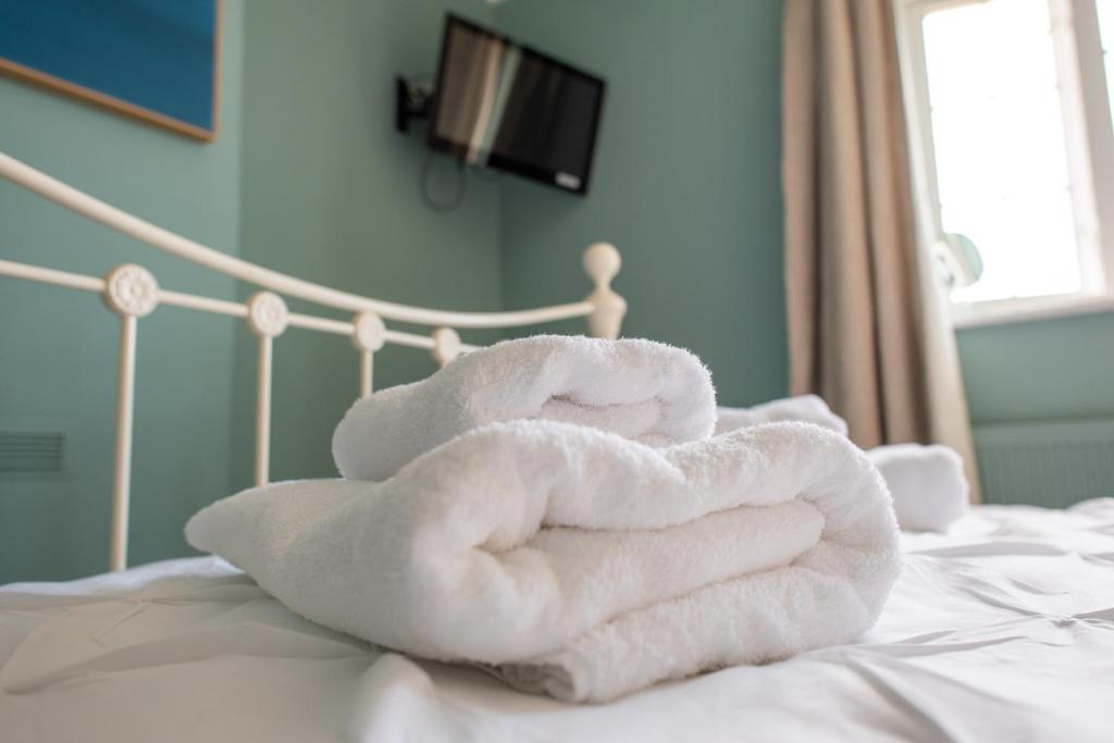 Кровать или кровати в номере Clovelly Guest House