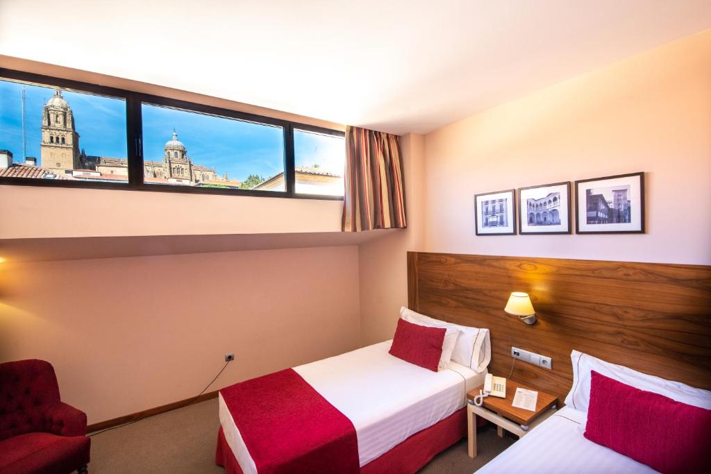 Posteľ alebo postele v izbe v ubytovaní Hospedium Hotel Casino Del Tormes