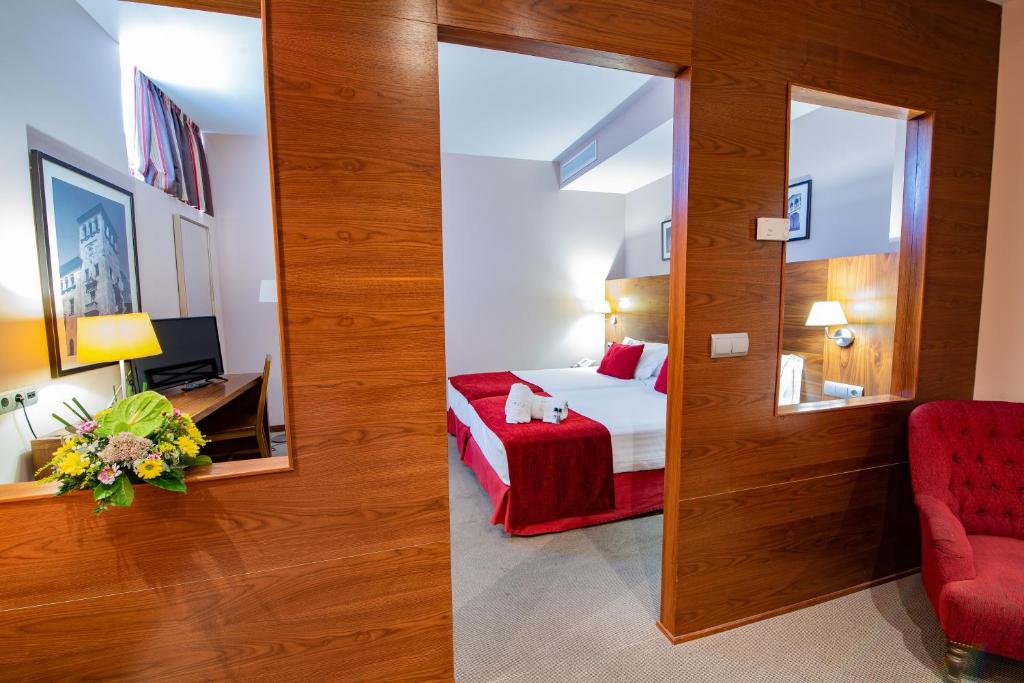 Posteľ alebo postele v izbe v ubytovaní Hospedium Hotel Casino Del Tormes