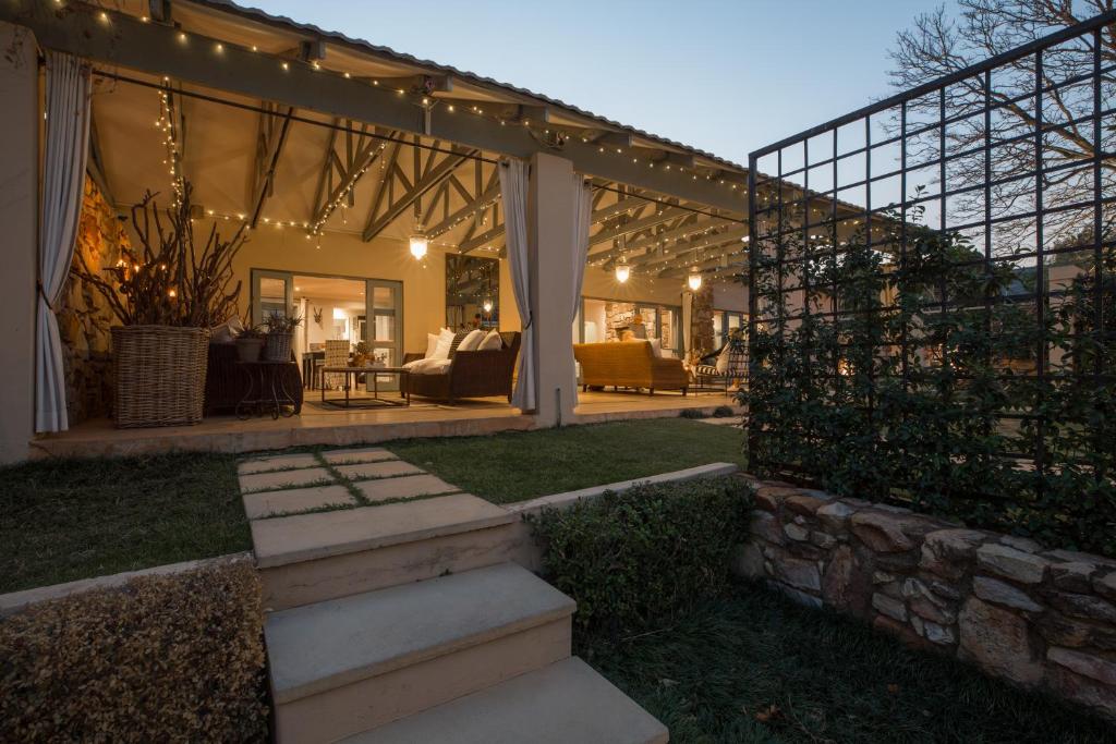 a home with a patio with lights and stairs at Parkwood Boutique Hotel in Johannesburg