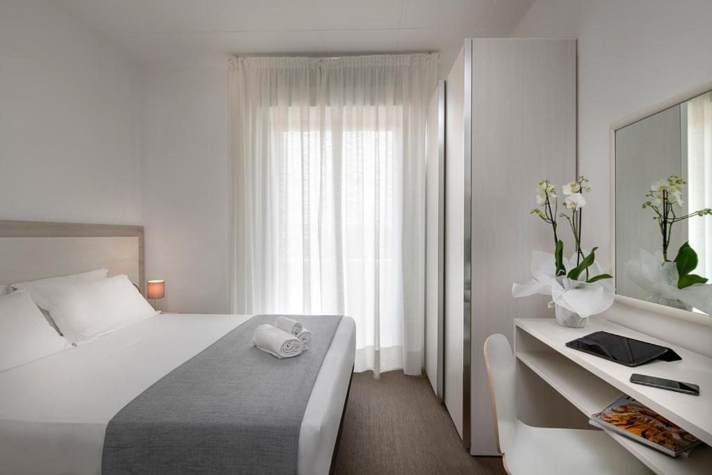 Postel nebo postele na pokoji v ubytování Hotel Cristina Corona