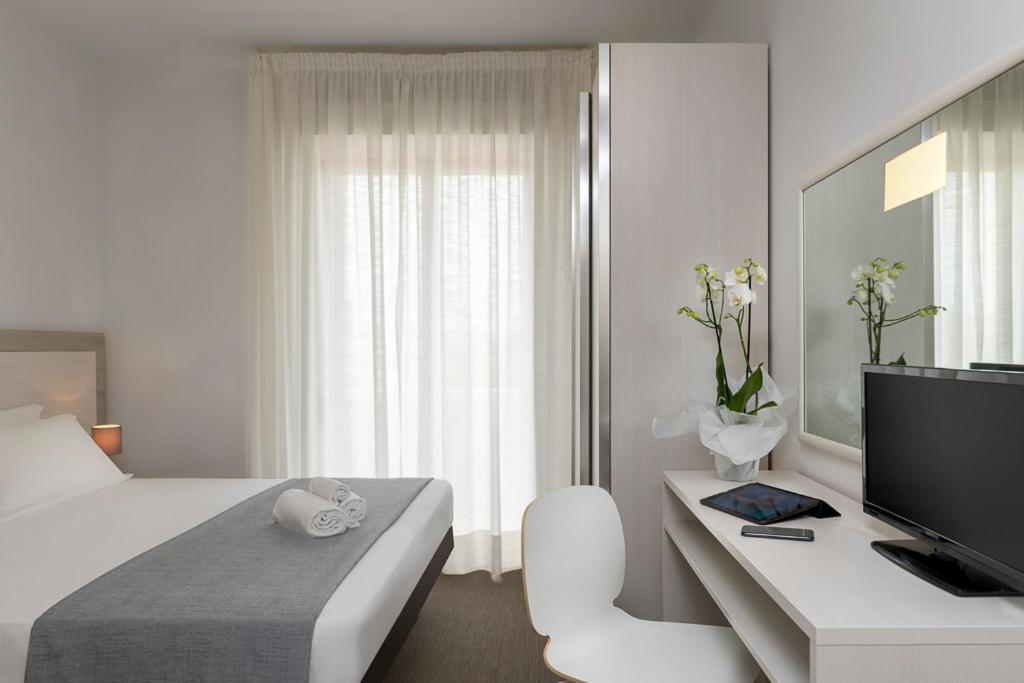 Postel nebo postele na pokoji v ubytování Hotel Cristina Corona