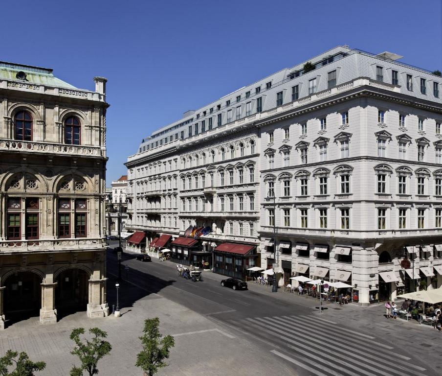 a large white building with a street in front of it at Hotel Sacher Wien in Vienna