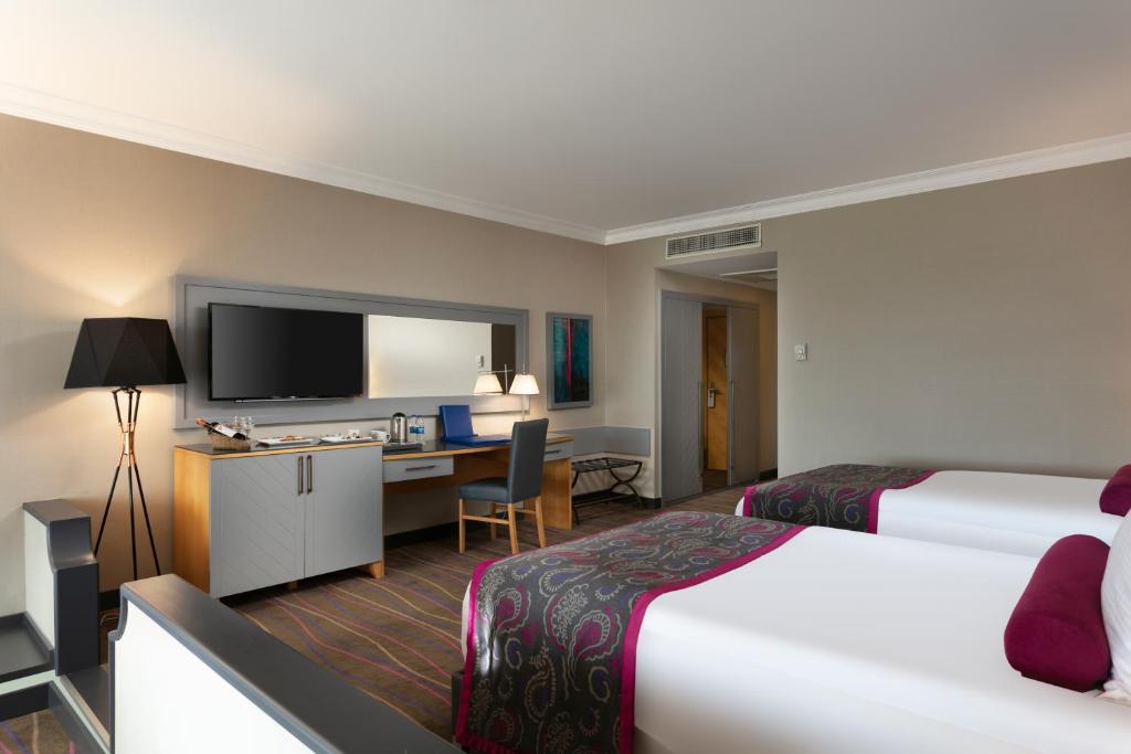 Postel nebo postele na pokoji v ubytování Sirene Belek Hotel