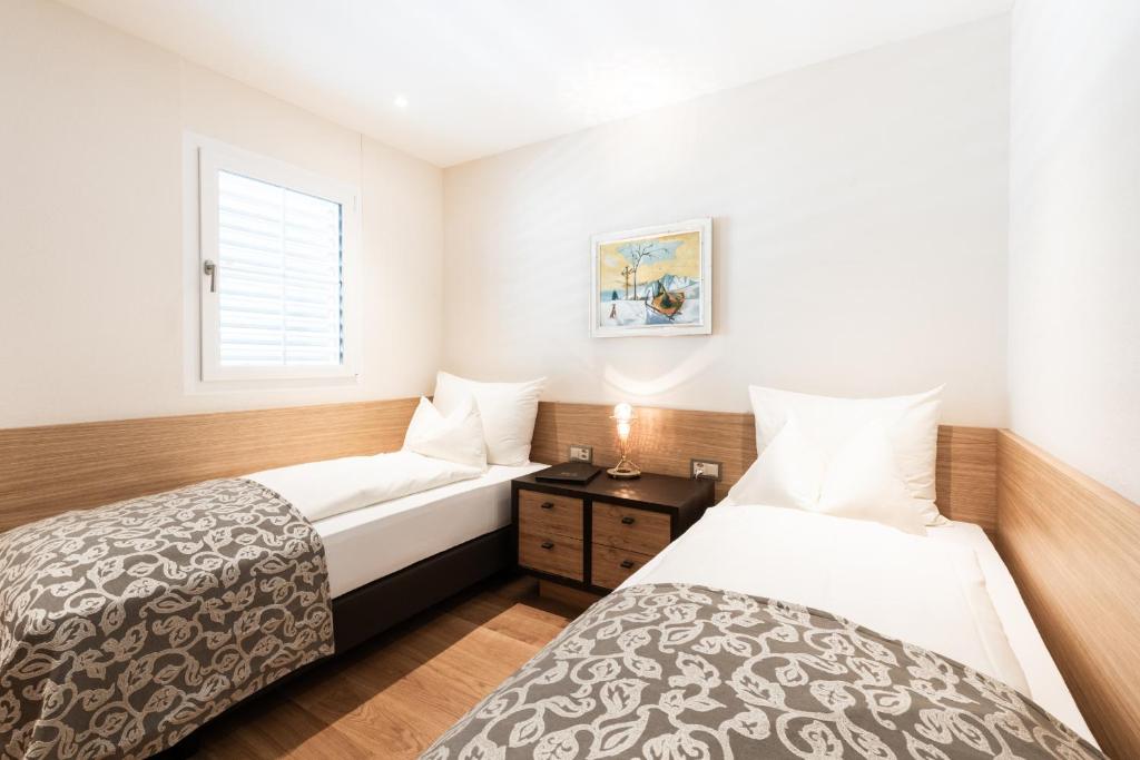 Postel nebo postele na pokoji v ubytování Hotel Alte Post Bonaduz