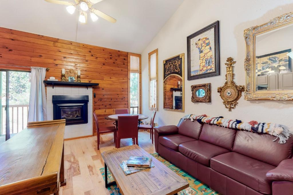 a living room with a couch and a table at Kings Run Relaxation in Kings Beach