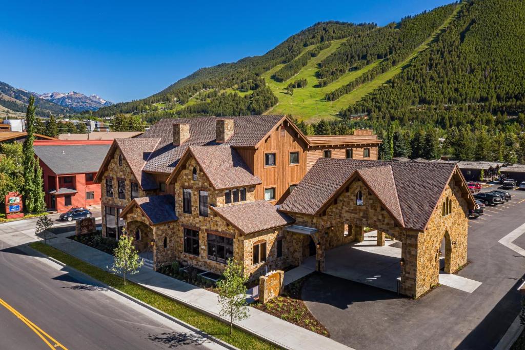 an aerial view of a house with a mountain at Elk Country Inn in Jackson