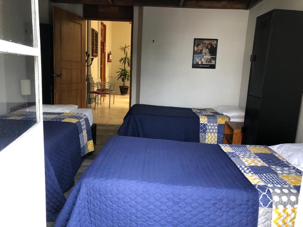 Postel nebo postele na pokoji v ubytování Hotel lit Guadalajara