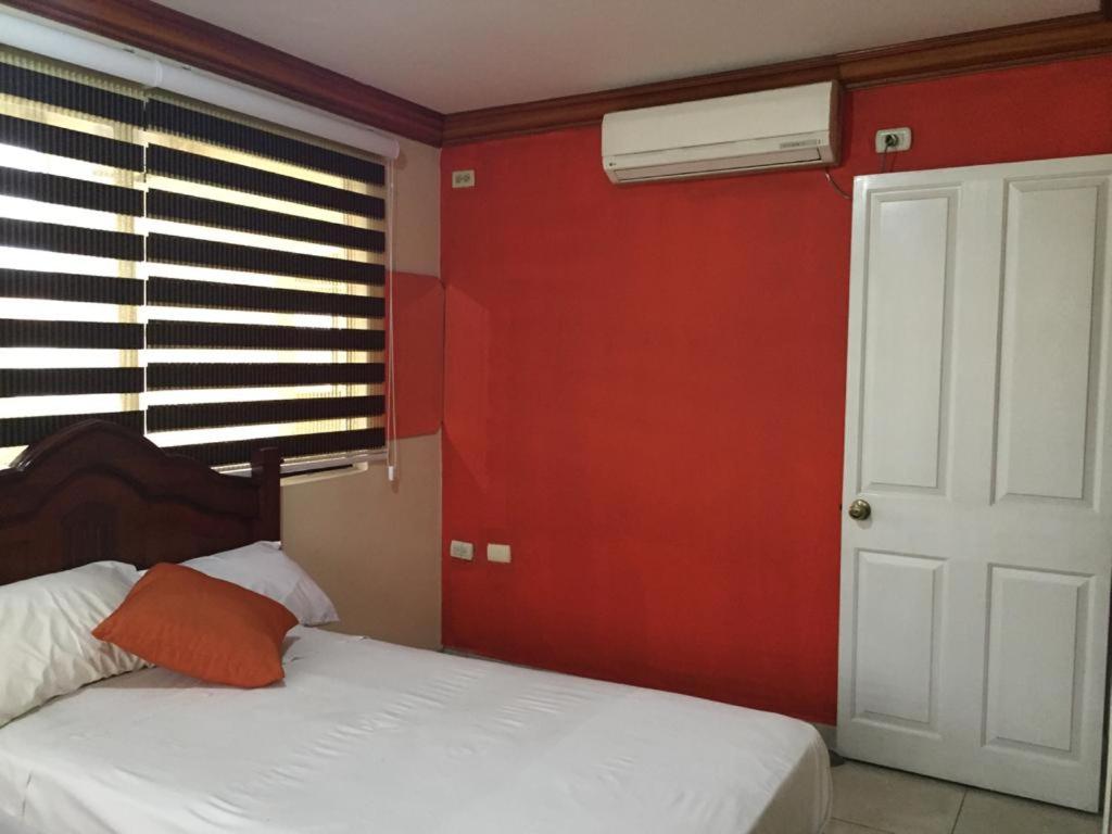 Postel nebo postele na pokoji v ubytování Hotel Fika Guayaquil