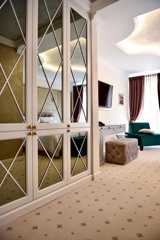 Postel nebo postele na pokoji v ubytování Villa Giardino Heritage Boutique Hotel Bol