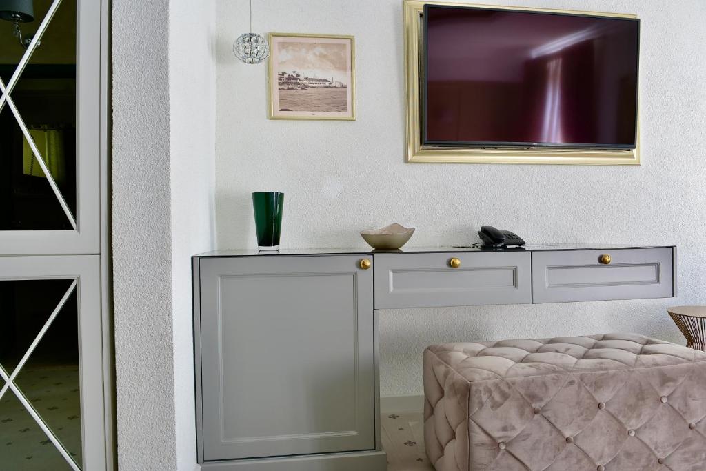 Postel nebo postele na pokoji v ubytování Villa Giardino Heritage Boutique Hotel Bol