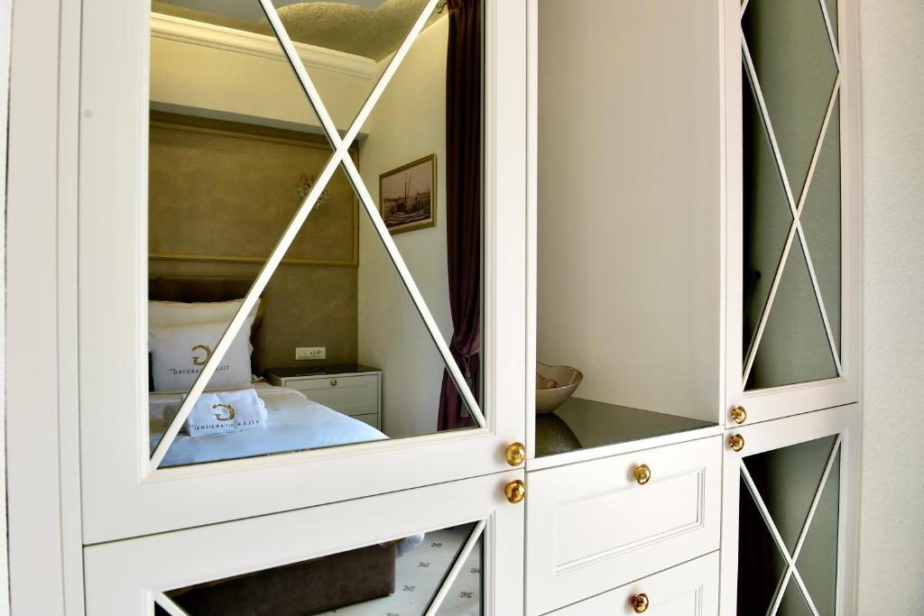 Postel nebo postele na pokoji v ubytování Villa Giardino Heritage Boutique Hotel Bol