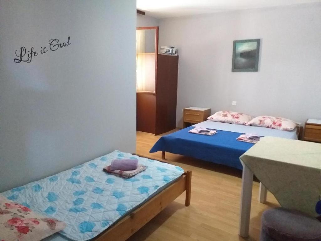 Posteľ alebo postele v izbe v ubytovaní Apartments Vidic