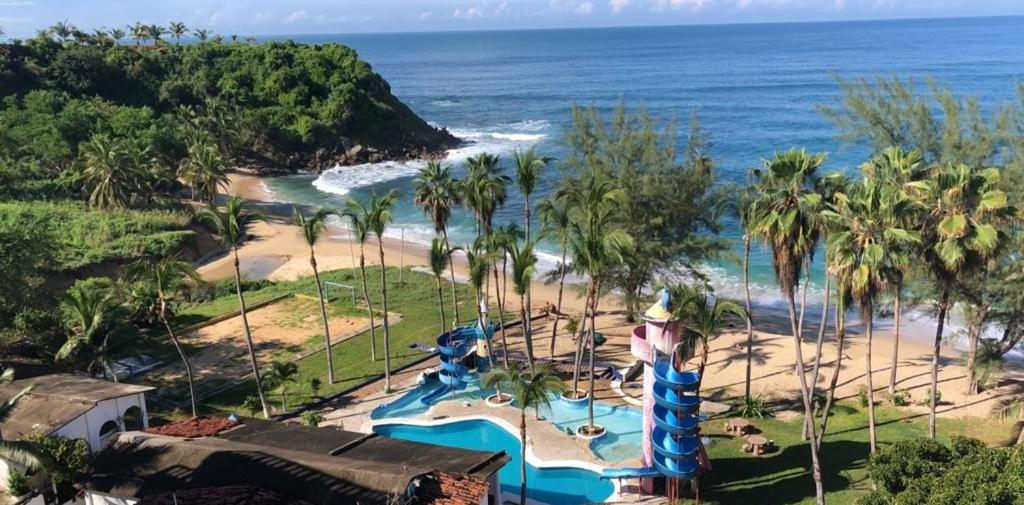 an aerial view of a water park next to the beach at Hotel Villa Mexicana Puerto Escondido in Puerto Escondido