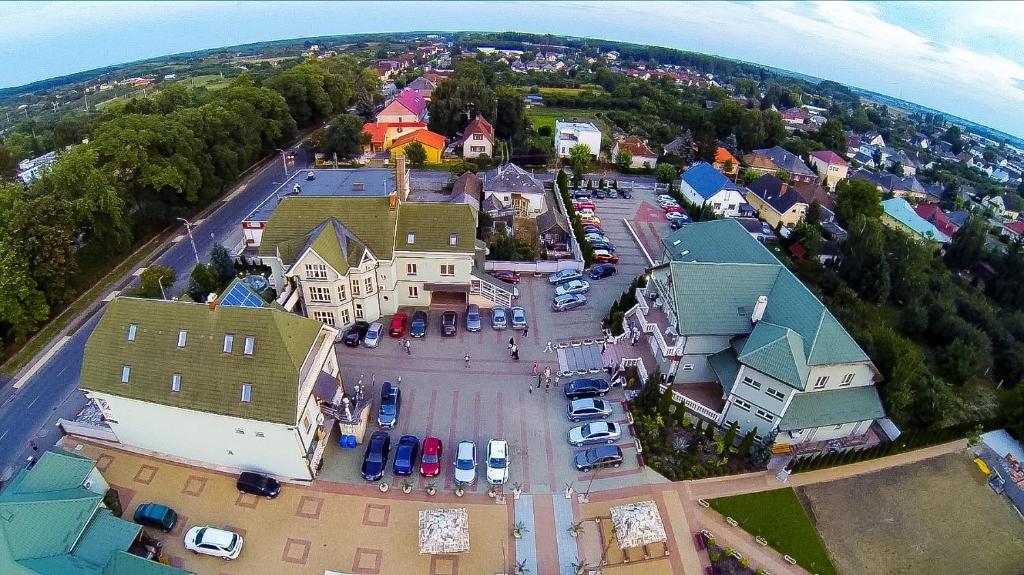 an aerial view of a small town with a parking lot at Parish Bull Hotel in Kisvárda