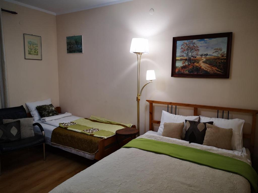 Llit o llits en una habitació de DomTurystyki Rodzinnej " Żabi Dołek "