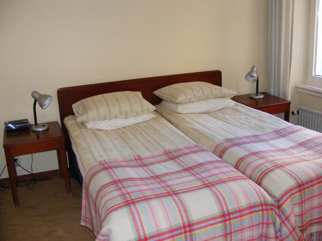 Postel nebo postele na pokoji v ubytování Hotel Continental Malmö