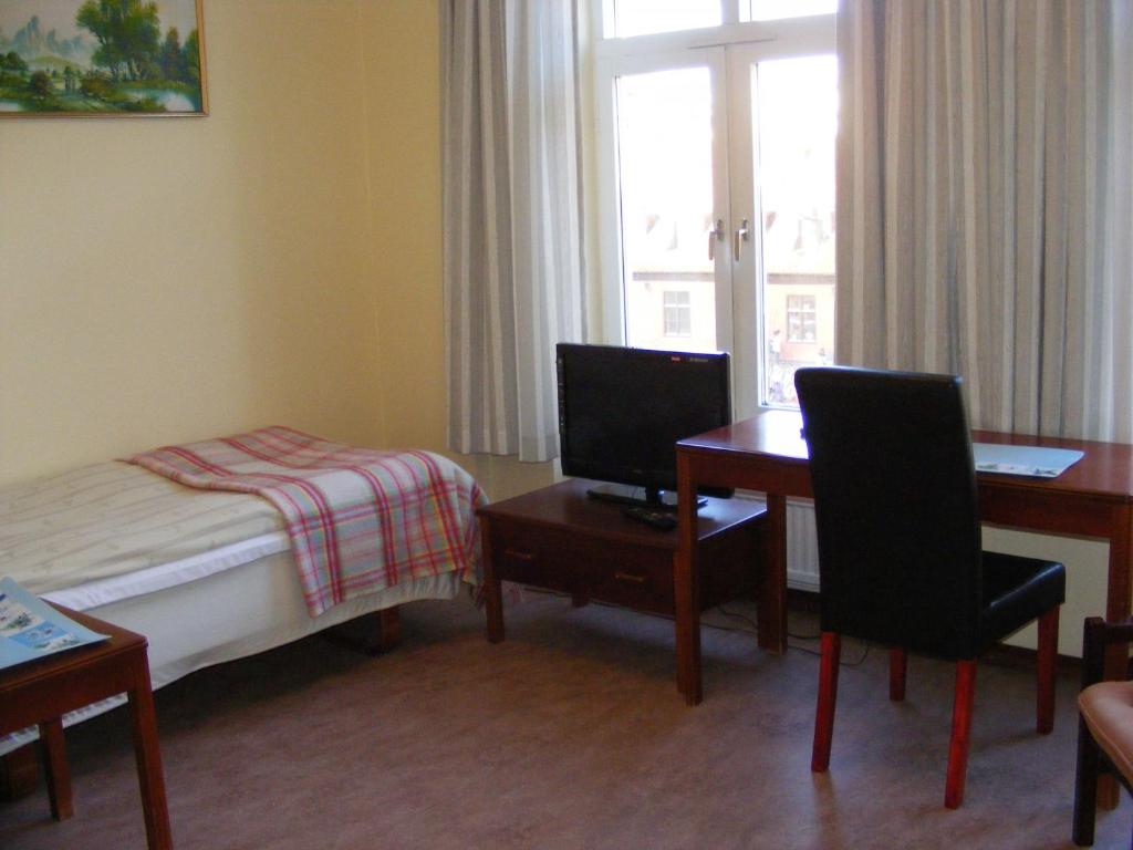 Postel nebo postele na pokoji v ubytování Hotel Continental Malmö