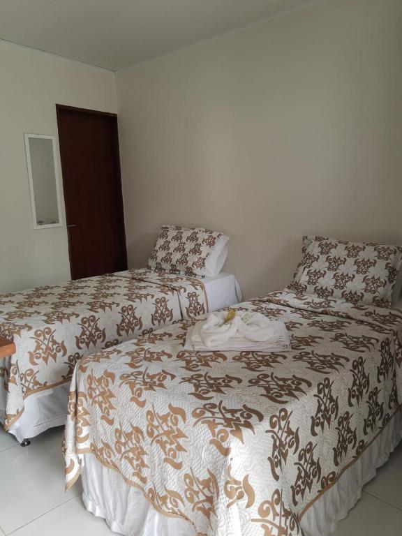 Cama ou camas em um quarto em Pousada Paraíso dos Milagres