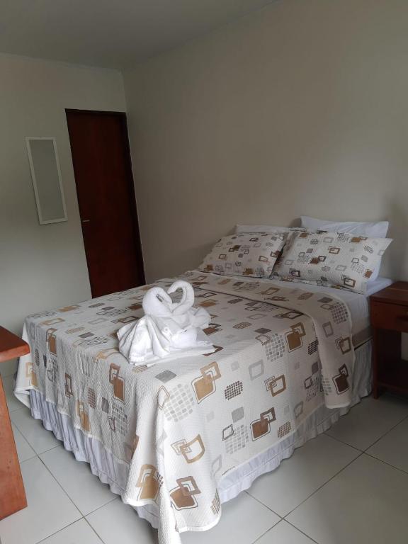Cama ou camas em um quarto em Pousada Paraíso dos Milagres
