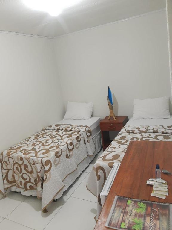 Cama ou camas em um quarto em Pousada Paraíso dos Milagres