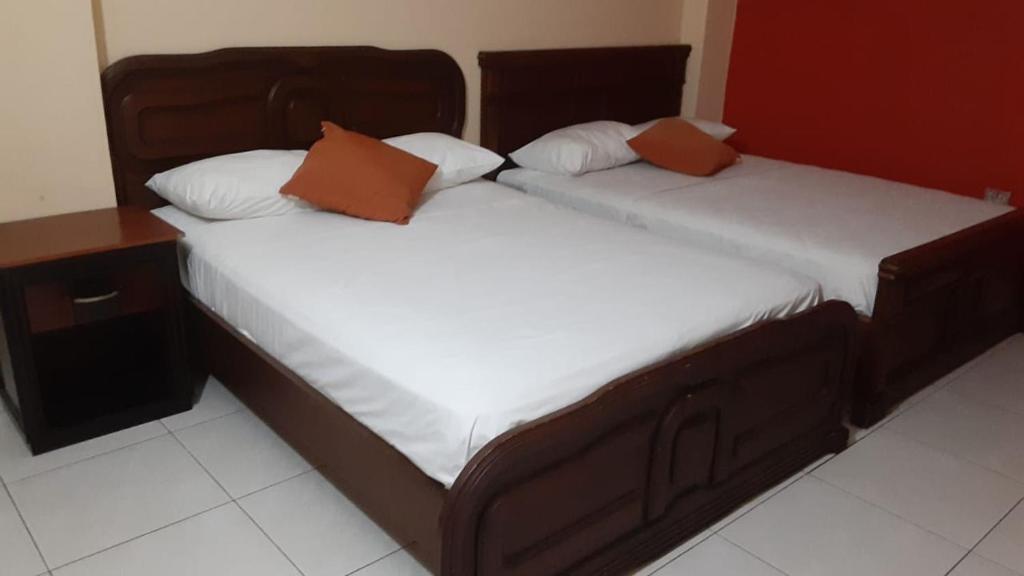 Postel nebo postele na pokoji v ubytování Hotel Fika Guayaquil