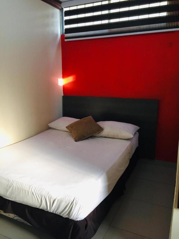 Postel nebo postele na pokoji v ubytování Hotel Fika Guayaquil