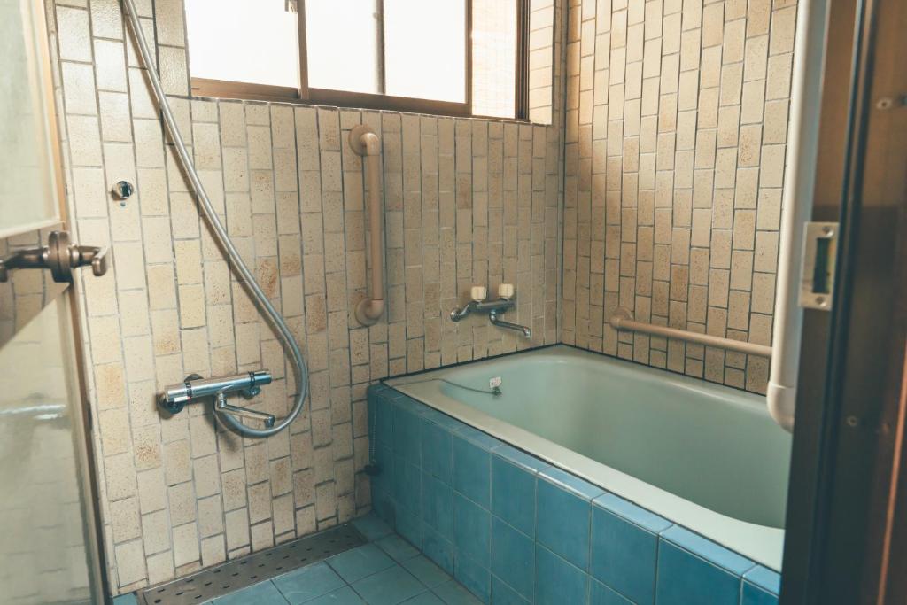 Koupelna v ubytování ゲストハウス 宰嘉庵 かなで GuestHouse Saikaan KANADE