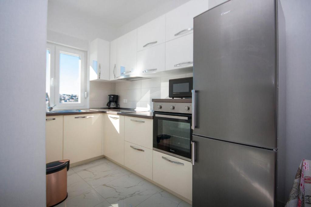 Kuchyňa alebo kuchynka v ubytovaní Apartments Osti