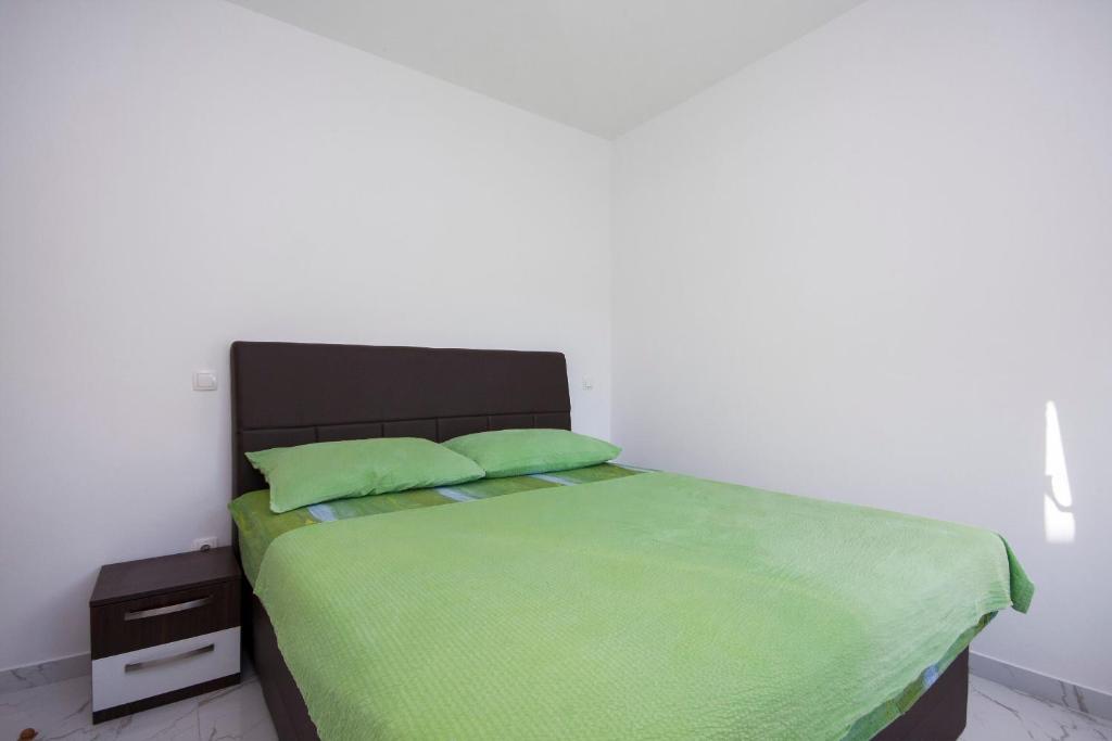 Posteľ alebo postele v izbe v ubytovaní Apartments Osti